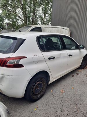 a white car that is parked in a parking lot