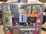 a metal cart with many items in it in a warehouse