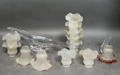 a lot of glass vases that are sitting on a table