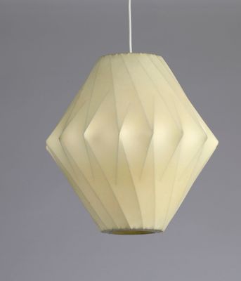 a close up of a white lamp hanging from a ceiling