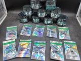 a pile of silver foil packets sitting on top of a table