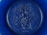 a blue plate with a picture of a man on it