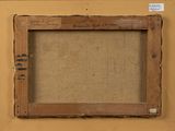 an old picture of a picture frame on a wall with a tag on it