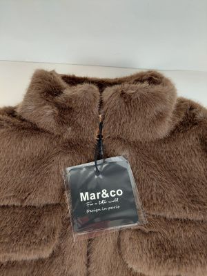a close up of a brown jacket with a tag on it