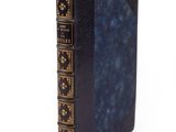 an image of a black book with gold trims