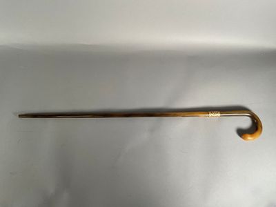 a long wooden handle that is attached to a metal rod