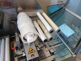 une image représentant une machine sur laquelle se trouve une bobine de papier