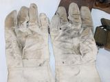 a pair of gloves that are sitting on a table