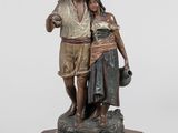 statue représentant un homme et une femme debout sur un socle