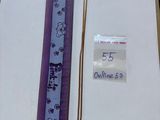 a ruler and a ruler on a table next to a piece of paper