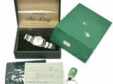 a box with a watch and a keychain in it