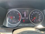 a close up of a car dashboard with various gauges