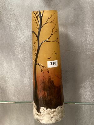 a vase that has a picture of a tree on it