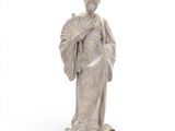 statue of a woman holding a fan and a fan in her hand
