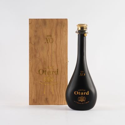 a bottle of wine sitting next to a wooden box