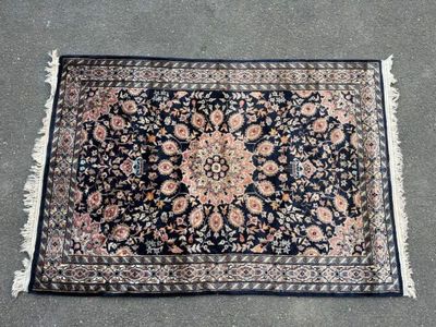 a close up of a rug on the ground with a black background