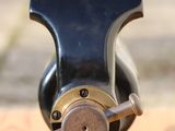 a small metal object that is on a wooden table