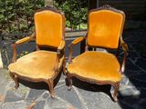 two chairs that are sitting next to each other