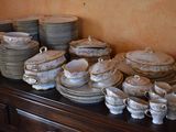 a lot of plates and bowls on a table