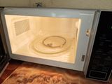 a microwave with a bowl inside of it on the counter