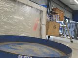 a picture of a large blue container in a warehouse