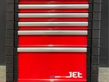 the red tool cabinet is sitting on top of the gray floor