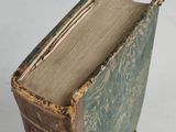an old book that is sitting on a table