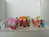 many different types of skin care products displayed on a counter