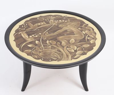 a black and gold table with a picture of a bird on it