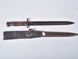 two knives that are laying on a white surface