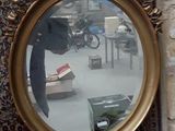 a picture of a mirror on the wall of a building