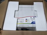 a box with a printer in it on a table