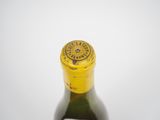 a bottle of wine that is sitting on a table