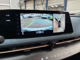 a picture of a car ' s rear view mirror with a camera attached to it