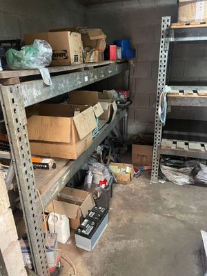 many boxes and boxes on the shelves in the garage
