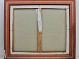 an old picture frame with a piece of paper sticking out of it