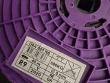 a purple spool that is sitting on a table