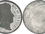 a close up of a coin with a profile of a man on it