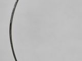 a white lamp on a marble base with a white shade
