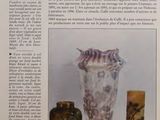 three vases sitting on a table in a book