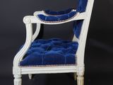an image of a white chair with a blue velvet upholstered seat
