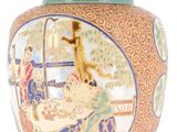 a vase with a lid that has a painting on it