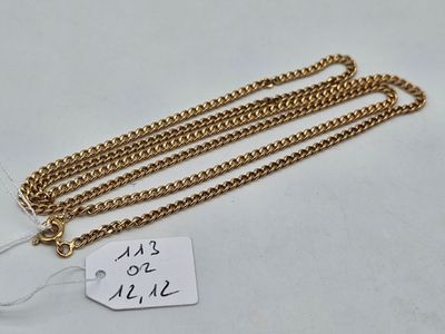 a close up of a gold chain with a tag on it