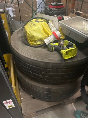a large tire sitting on a pallet in a warehouse