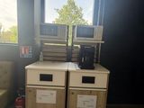 two microwaves and a couch in a room