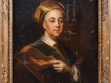 portrait of a man in a turban holding a book