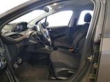 the interior of a car with the door open and the driver ' s seat down