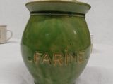 a green jar with the word farine written on it