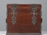 an old wooden chest with ornate carvings on the sides