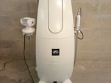 a white machine that is sitting on the floor